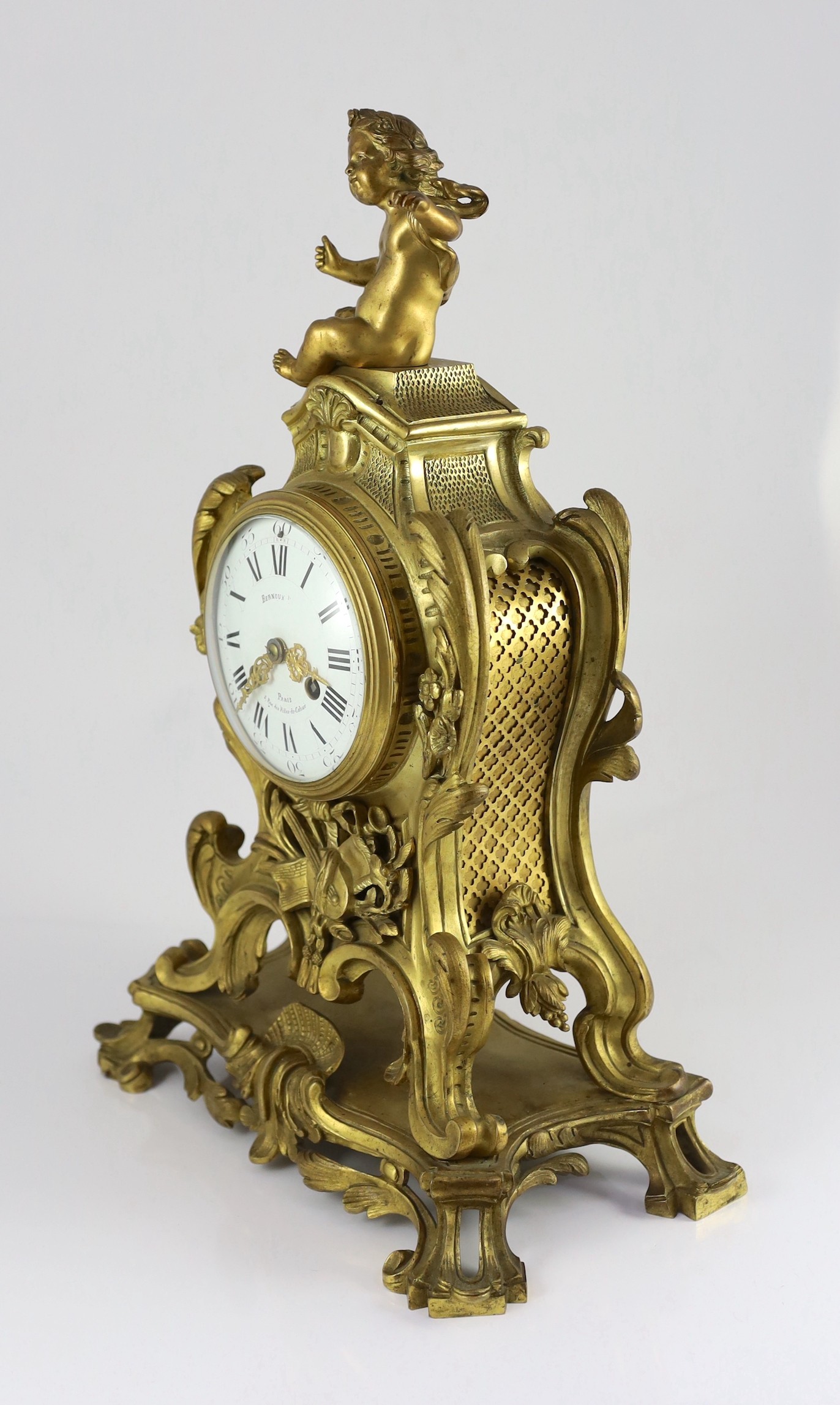 Bernoux of Paris. A 19th century Louis XV style ormolu mantel clock, 33cm wide, 48cm high